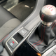 The Si’s shifter feels heftier, red stitching in the cockpit adds 10 HP